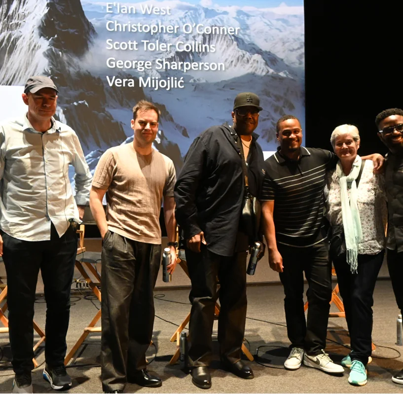 E'Ian West on stage with fellow filmmakers Christopher O'Conner, Scott Toler Collins, George Sharperson, and Vera Mijojlić at a panel discussion E'Ian West on stage with fellow filmmakers Christopher O'Conner, Scott Toler Collins, George Sharperson, and Vera Mijojlić at a panel discussion