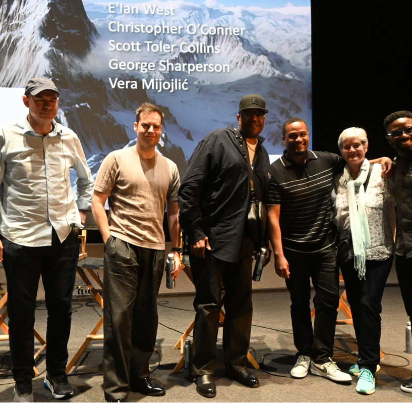E'Ian West on stage with fellow filmmakers Christopher O'Conner, Scott Toler Collins, George Sharperson, and Vera Mijojlić at a panel discussion E'Ian West on stage with fellow filmmakers Christopher O'Conner, Scott Toler Collins, George Sharperson, and Vera Mijojlić at a panel discussion